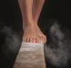 A woman's feet on a balance beam